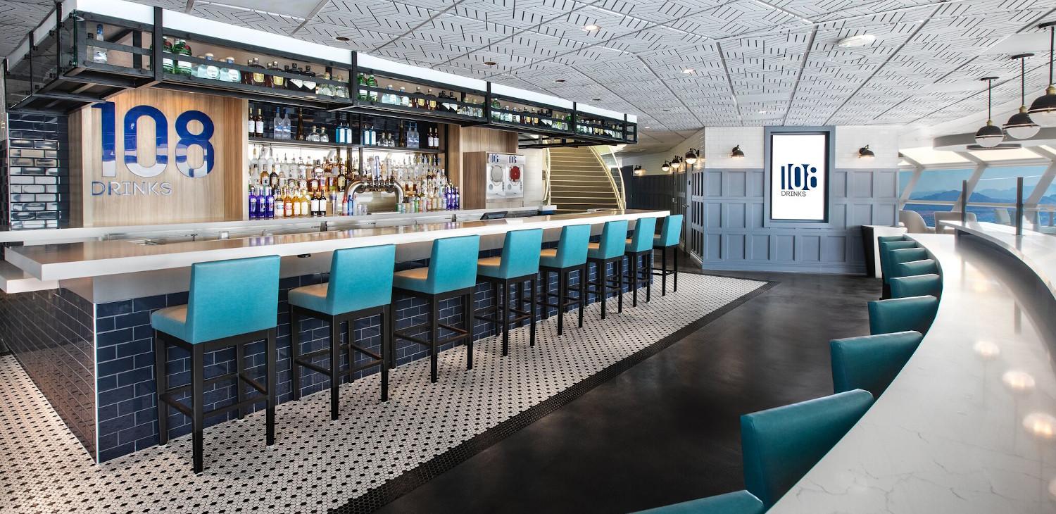 Two couples having drinks with view of Las Vegas